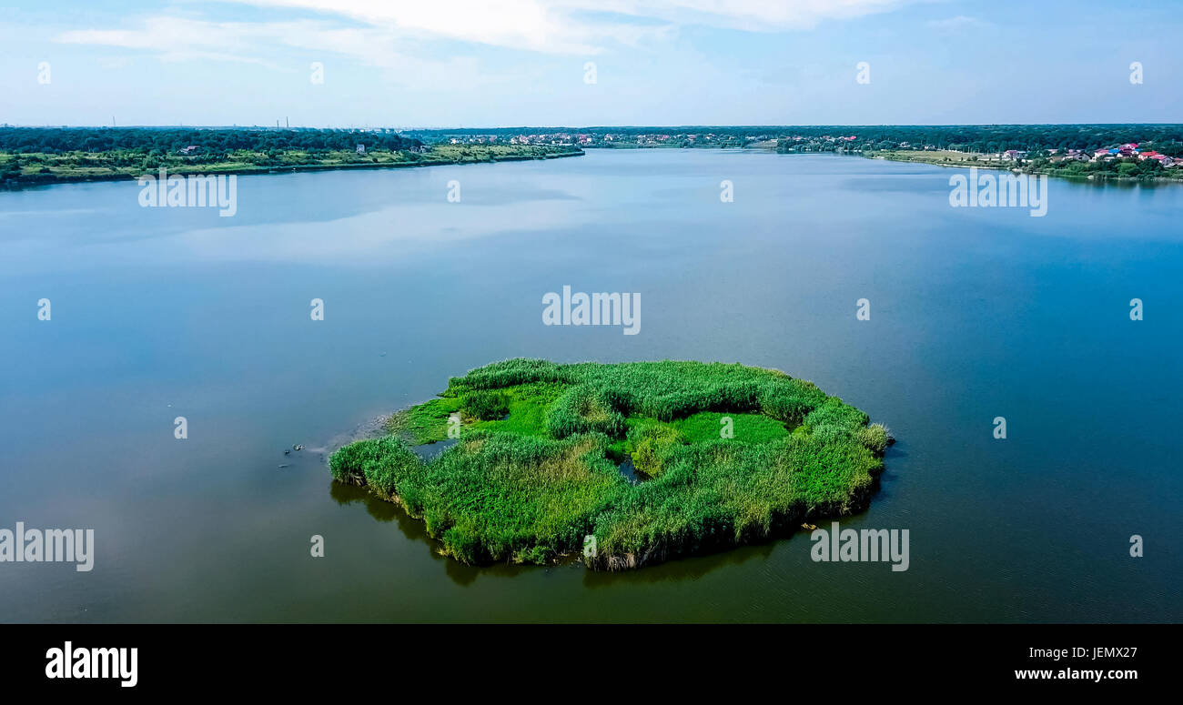 Aerial Drone View Of Small Green Island Lake On Blue Sky In Summer ...