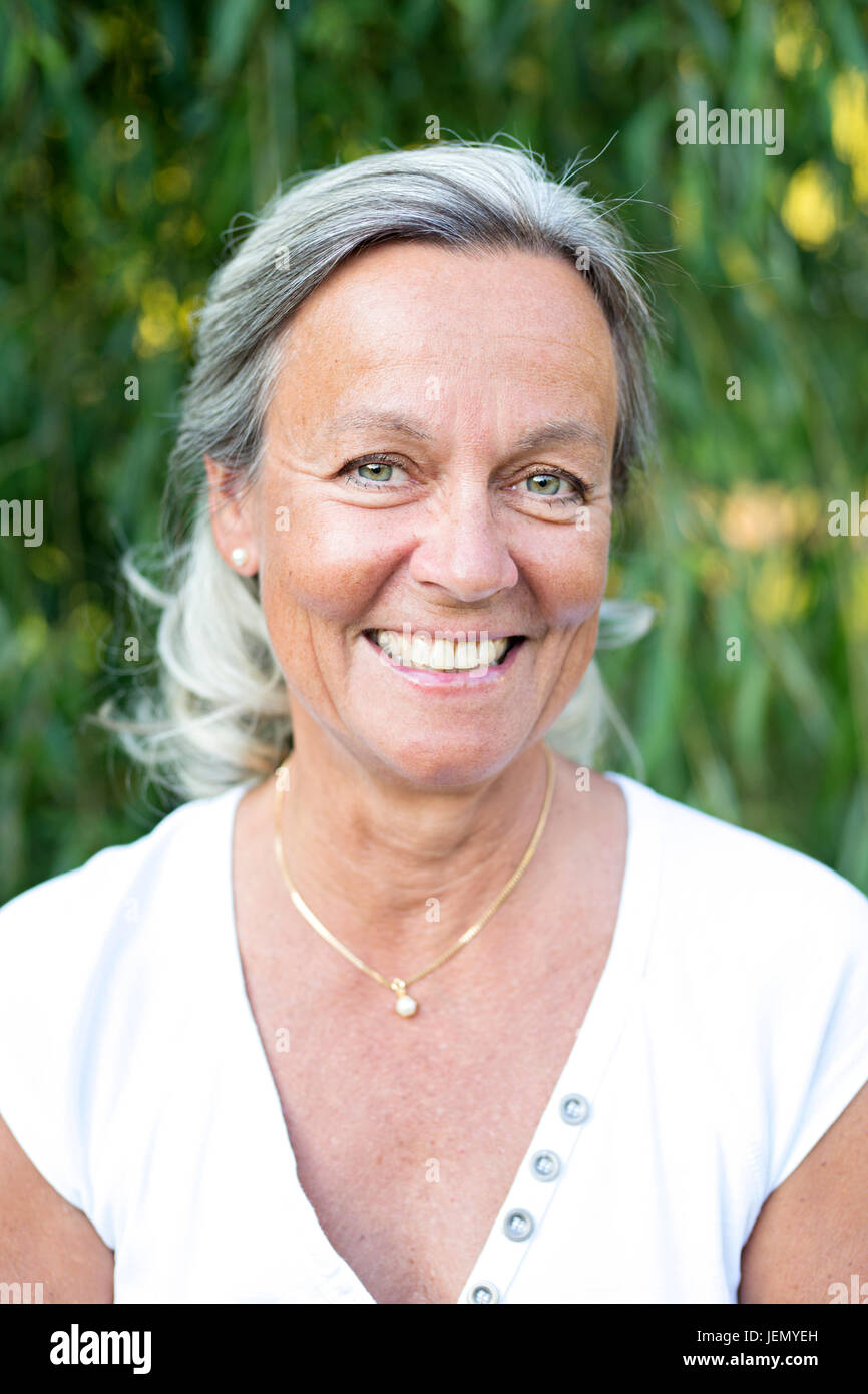 Portrait of smiling mature woman Stock Photo - Alamy