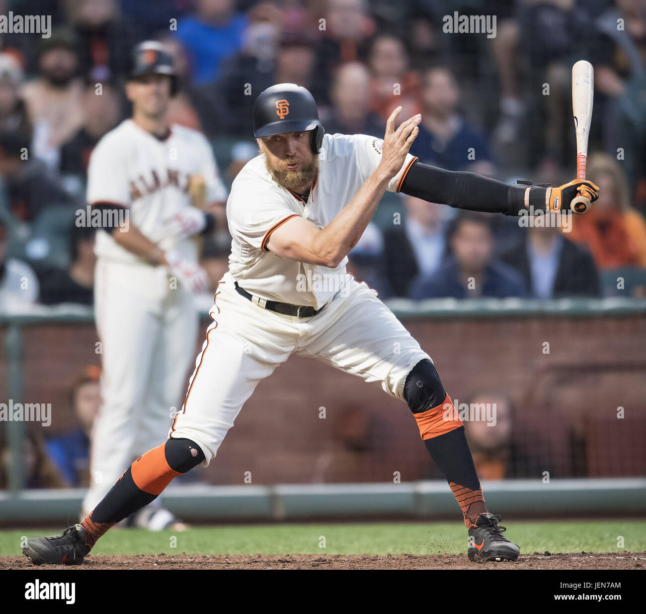San Francisco, California, USA. 26th June, 2017. San Francisco Giants catcher Buster Posey (28) looks on as right fielder Hunter Pence (8) reacts to striking out in the fourth inning, during a MLB baseball game between the Colorado Rockies and the San Francisco Giants on LGBT Night at AT&T Park in San Francisco, California. Valerie Shoaps/CSM/Alamy Live News Stock Photo
