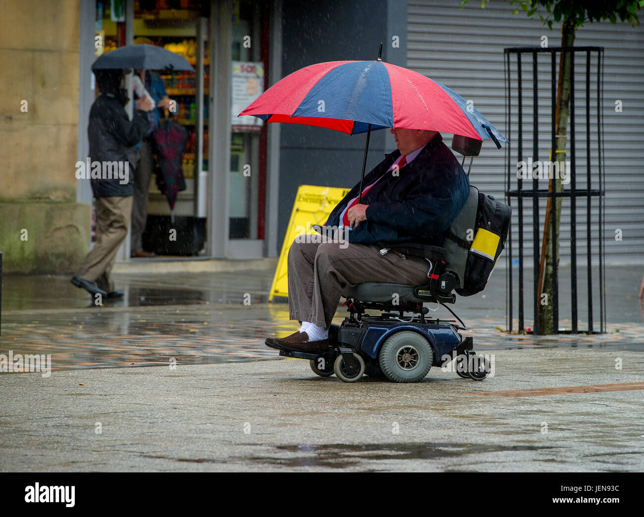 Bolton, Lancashire, UK. 27th June, 2017. It was definitely an umbrella day as a filthy wet morning greeted shoppers and people going to work through Victoria Square in Bolton, Lancashire, UK. The north west of England has been issued with a yellow warning for torrential rain for the next 24 hours. Picture by Paul Heyes, Tuesday June 27, 2017. Credit: Paul Heyes/Alamy Live News Stock Photo