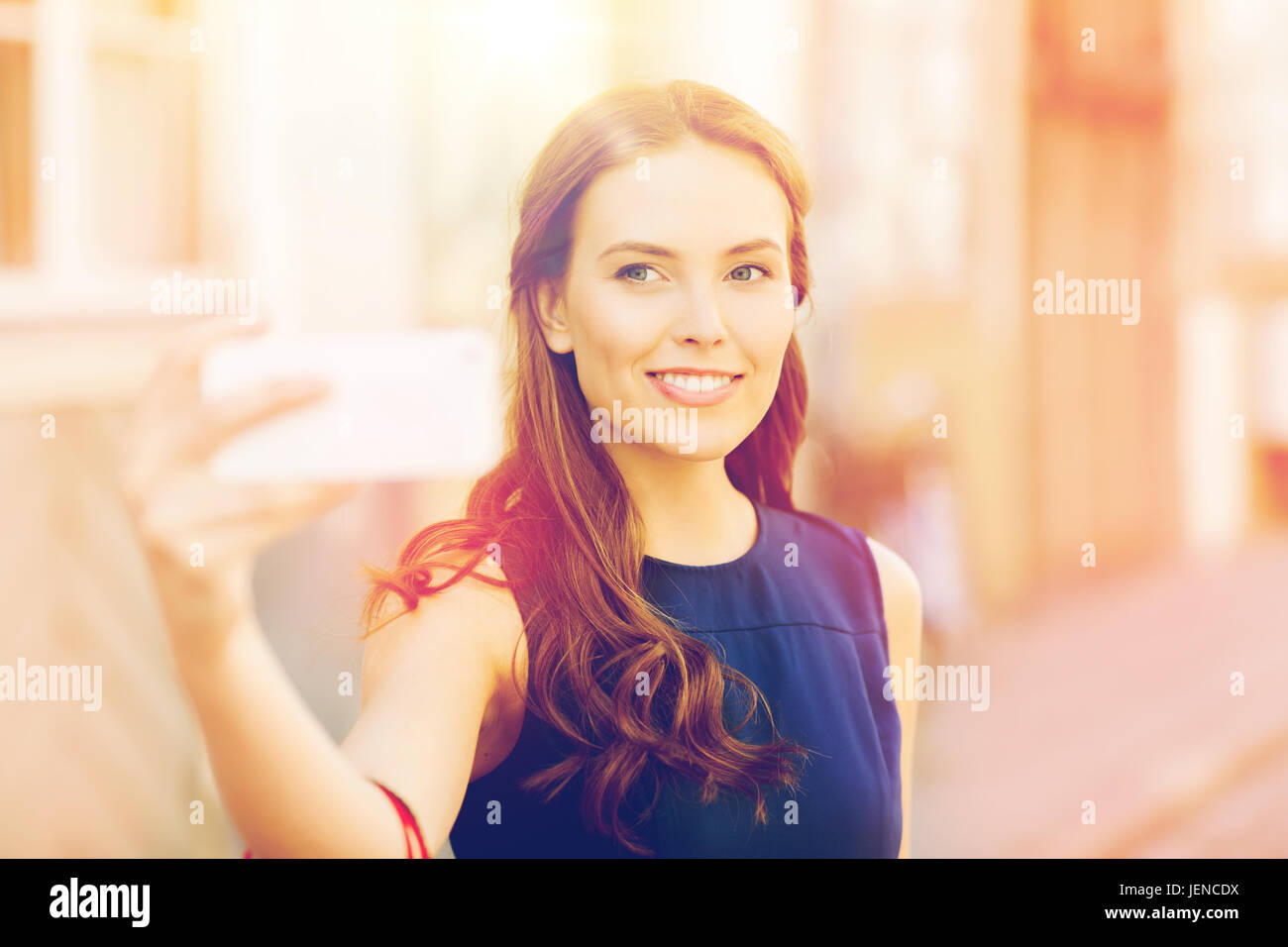 happy woman taking selfie with smartphone in city Stock Photo - Alamy