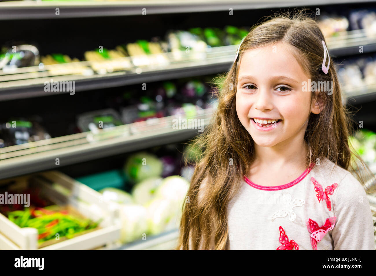 Cute girl smiling at the camera Stock Photo - Alamy