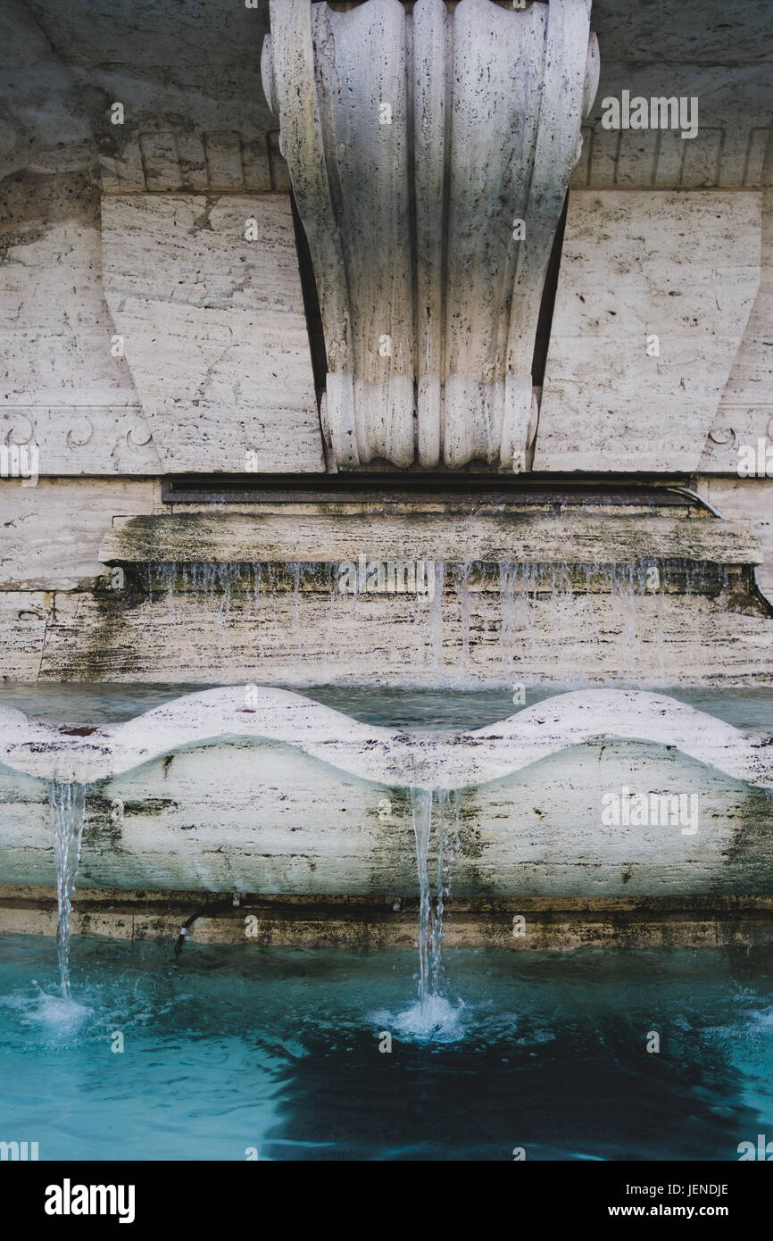Closeup of a classical fountain in Rome, Italy, made out of stone. Stock Photo