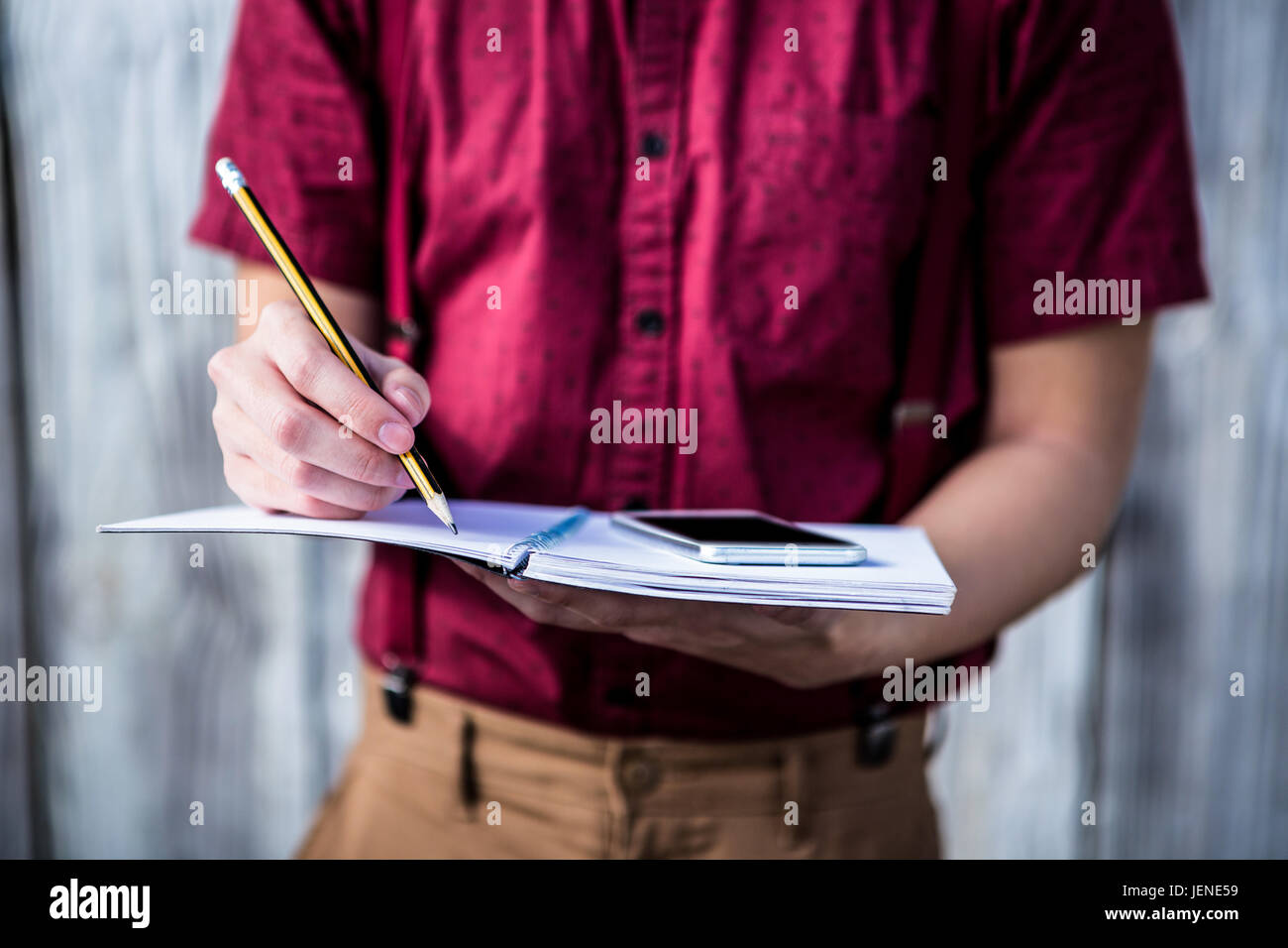 Hipster takes notes with his smartphone Stock Photo - Alamy