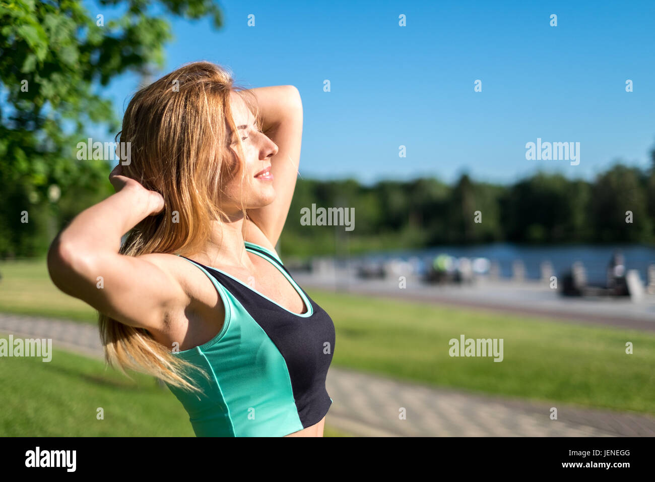 Woman stretching park hi-res stock photography and images - Alamy