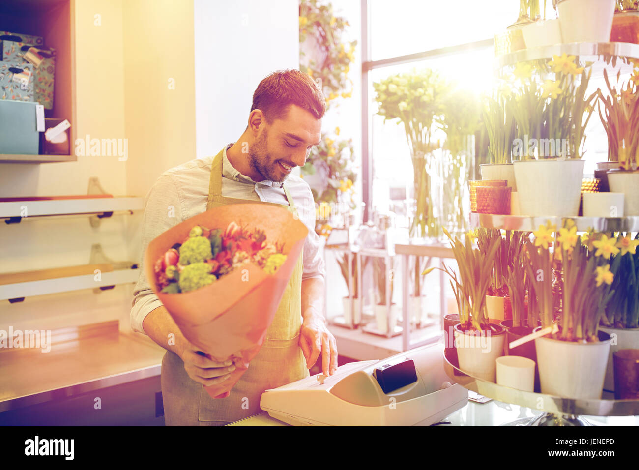 florist man or seller at flower shop cashbox Stock Photo - Alamy