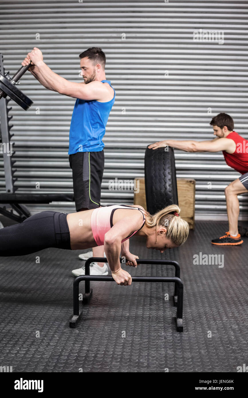 Fit people doing exercises Stock Photo