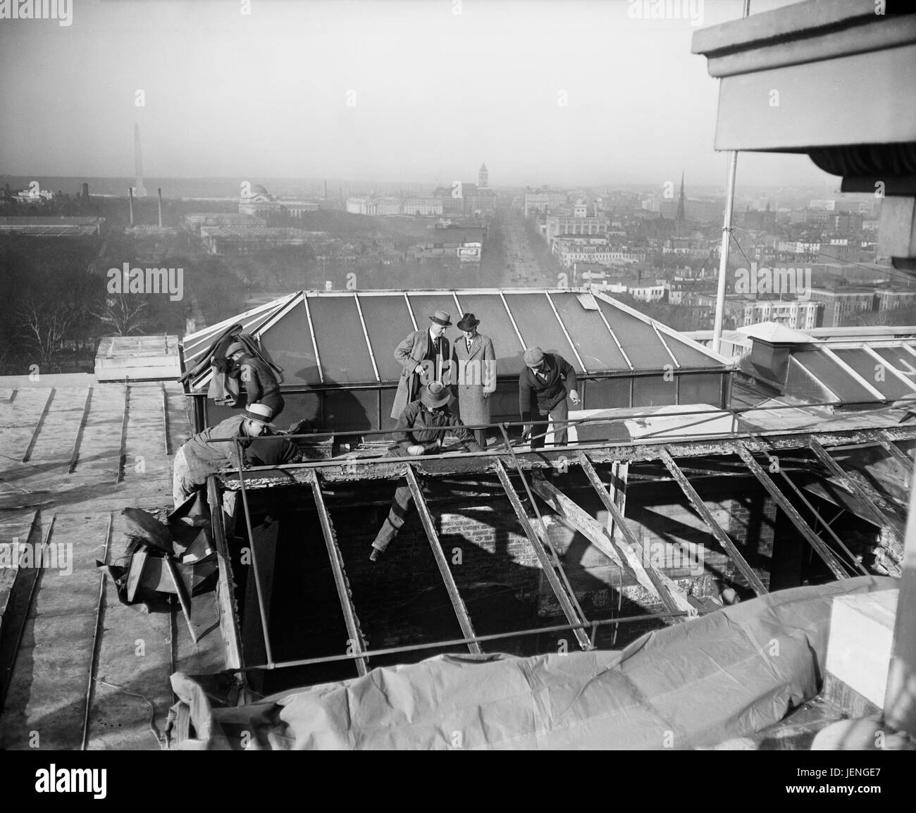 Group of Men Examining Damage to Roof of U.S. Capitol Building after Fire, Washington DC, USA, Harris & Ewing, January 1930 Stock Photo