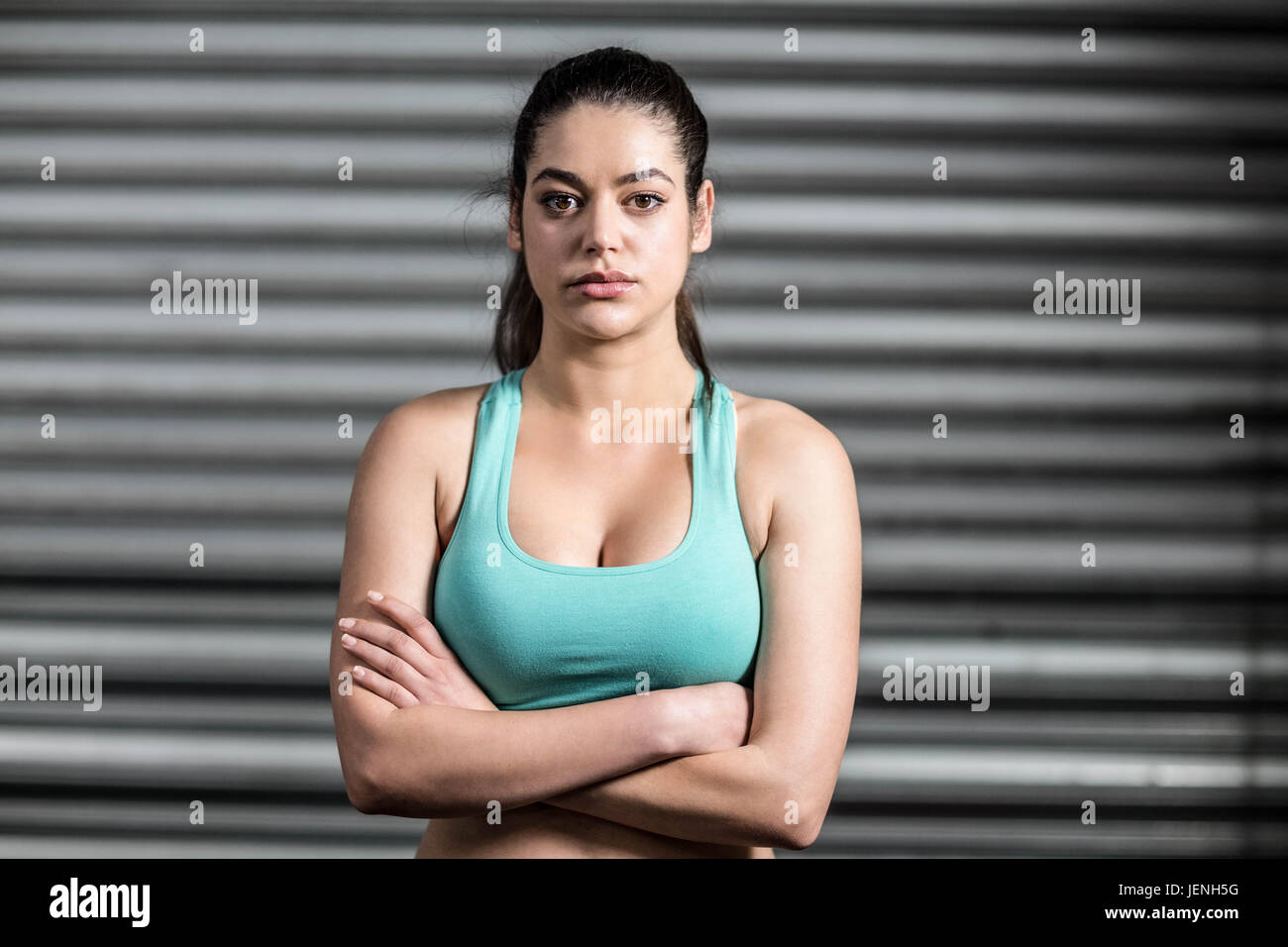 Portrait fit woman arms crossed hi-res stock photography and images - Alamy