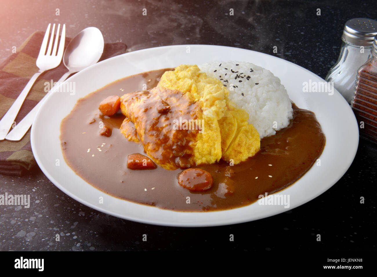 Rice with omelette curry in Japanese style or omu kare in white plate ready to eat Stock Photo