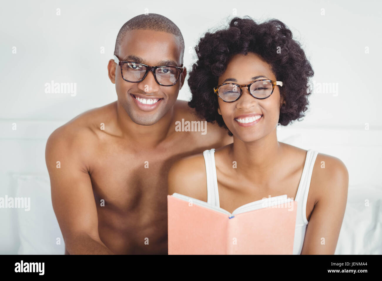 happy couple reading a book together Stock Photo Alamy