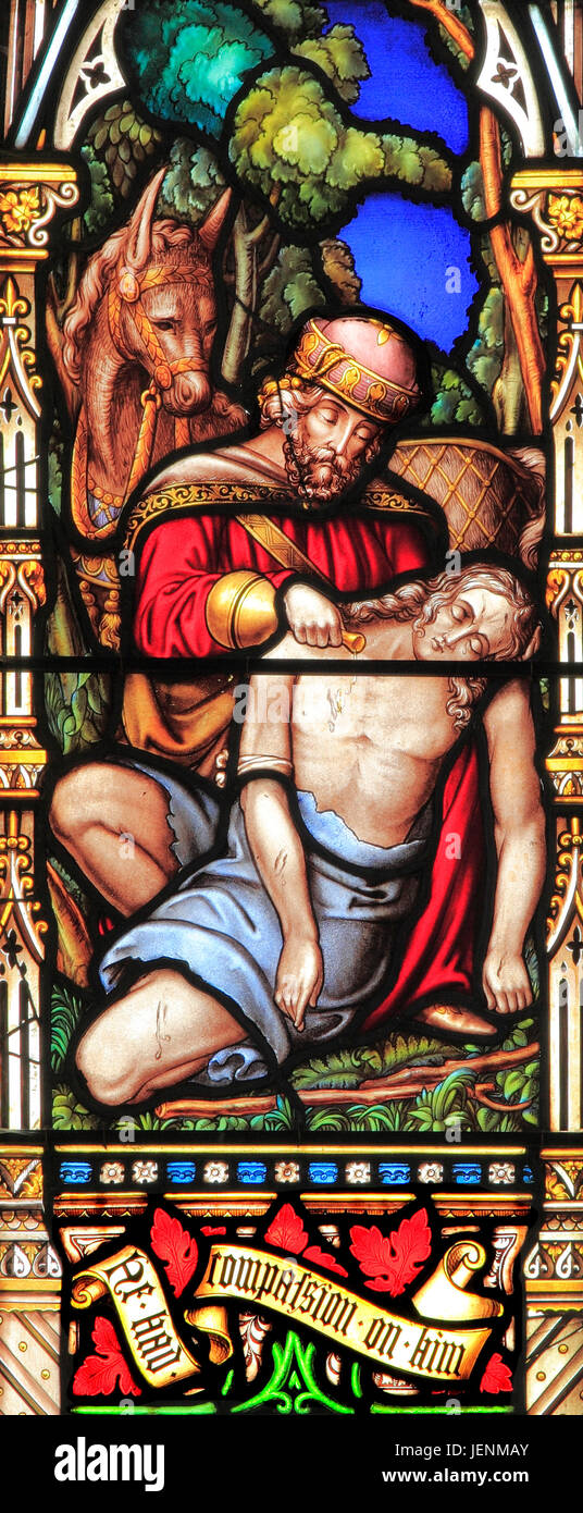 Good Samaritan Parable, tending traveller's injuries, giving water, 'He had compassion on him', stained glass window, by William Warrington, 1856 Stock Photo