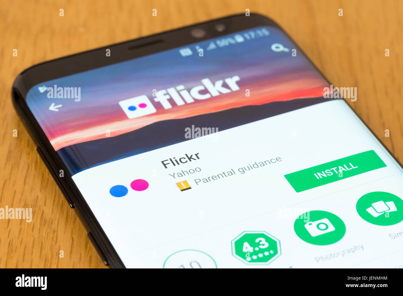 A closeup on the Flickr app install screen on a smartphone Stock Photo