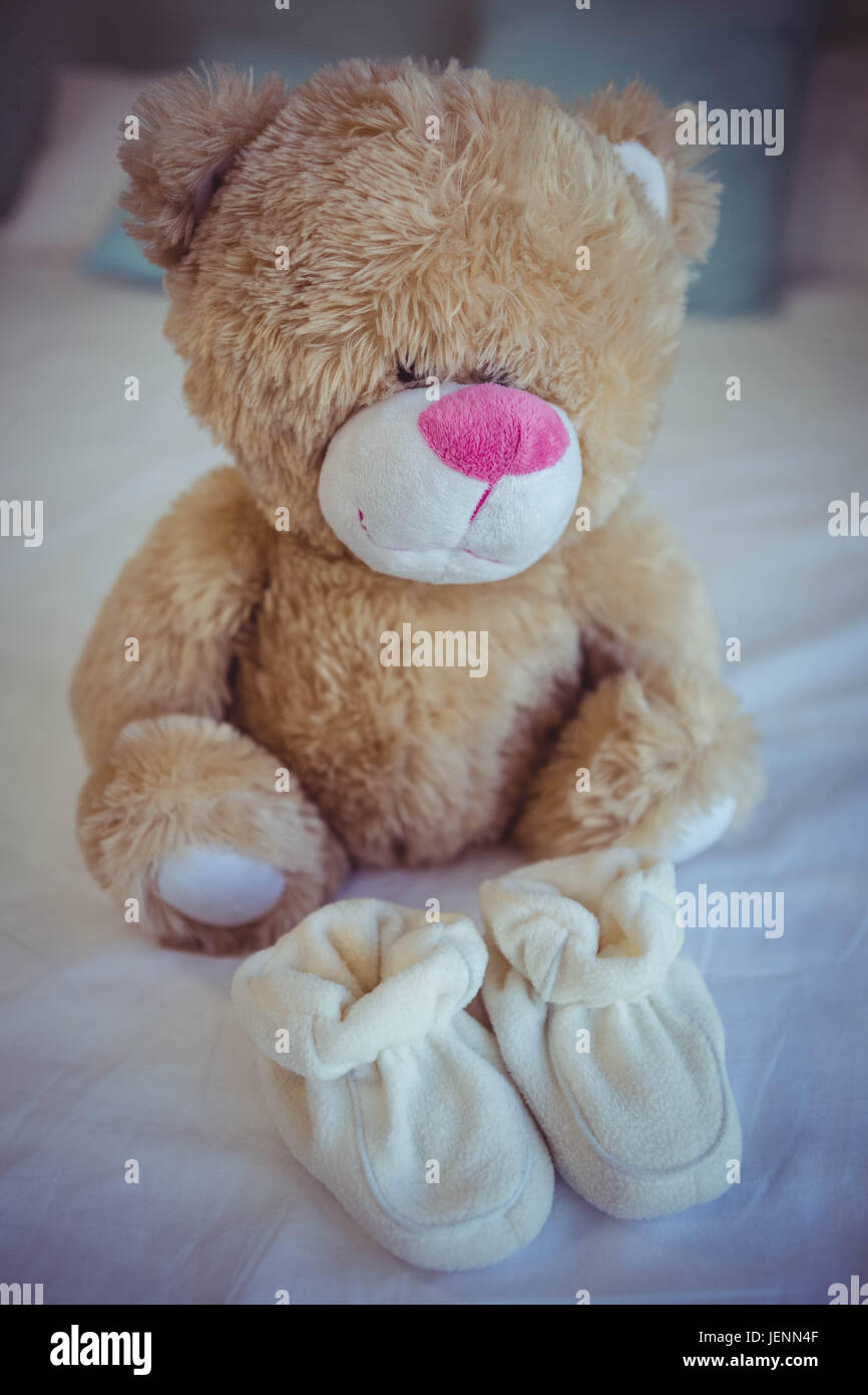 View of teddy bear and baby socks Stock Photo Alamy