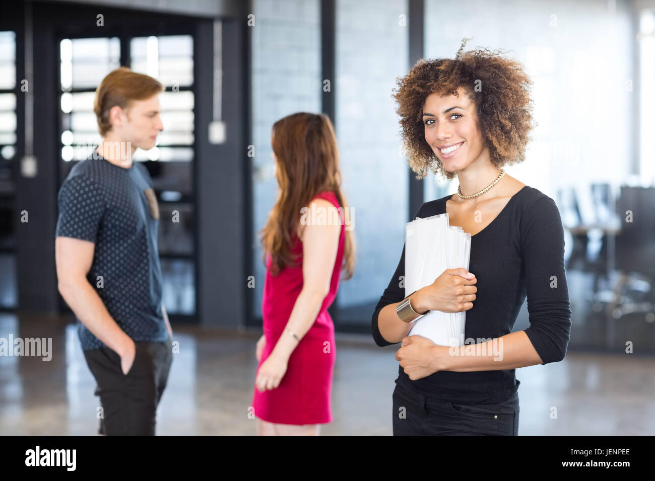 Portrait of business executive smiling Stock Photo - Alamy