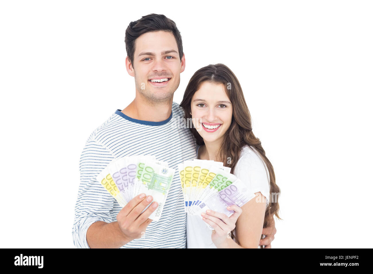 Happy couple holding money Stock Photo - Alamy