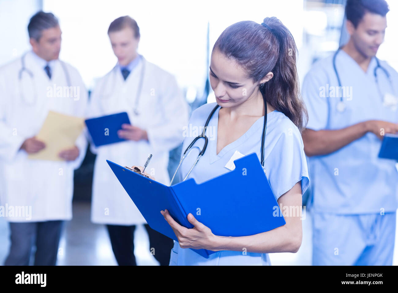 Indian female doctor holding report hi-res stock photography and images ...
