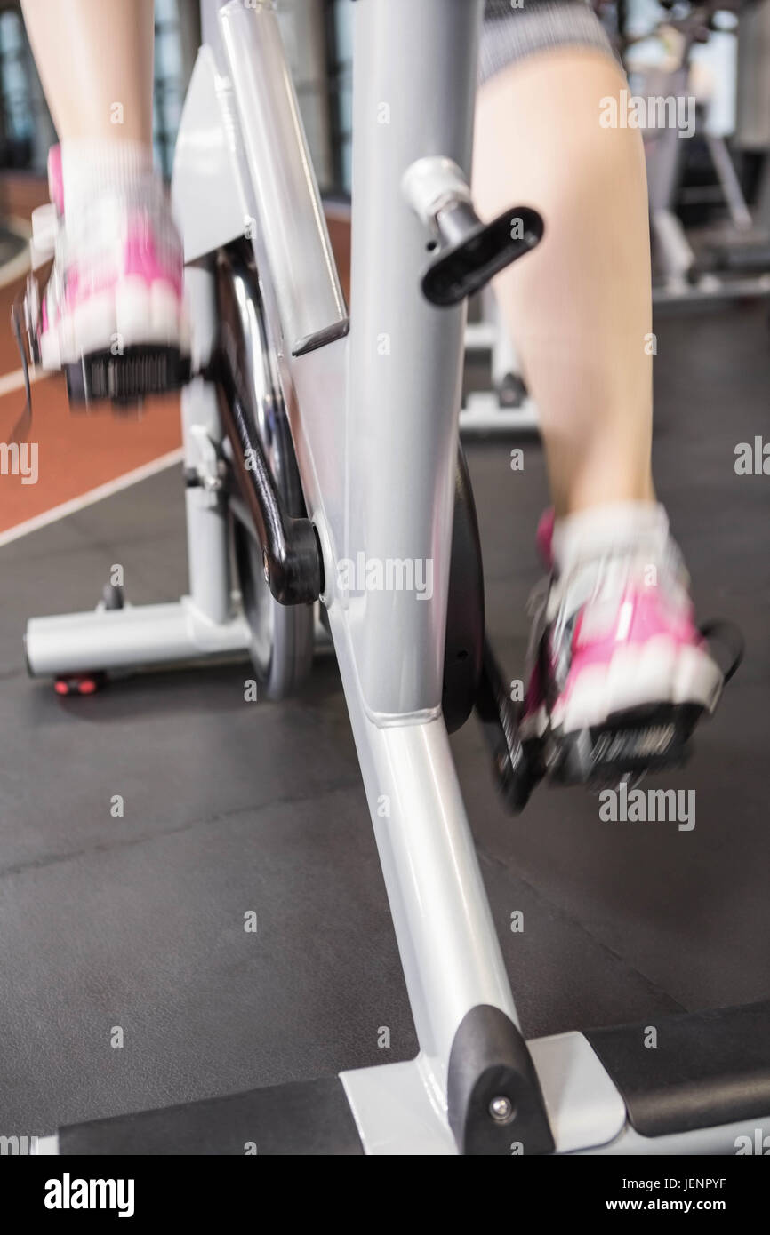 Pregnant woman using exercise bike Stock Photo Alamy