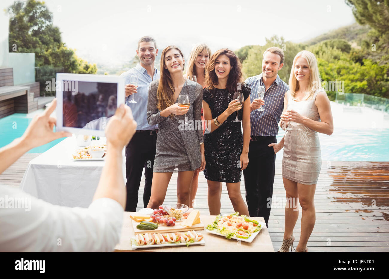 Group of friends posing for photograph Stock Photo - Alamy