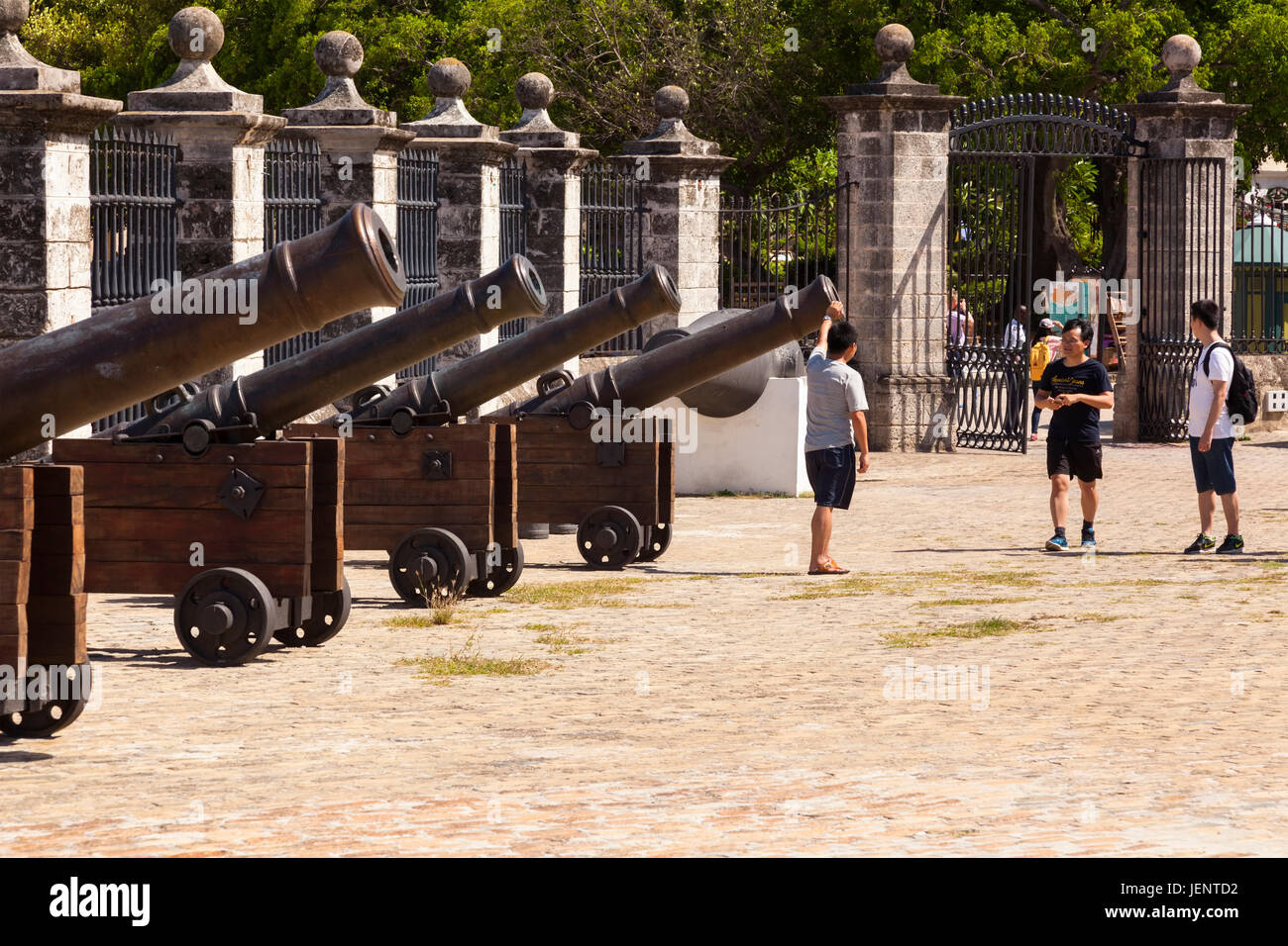 Tourists in front of cannons at Castillo de la Real Fuerza or Castle of the Royal Force a museum in Havana, Cuba. Stock Photo