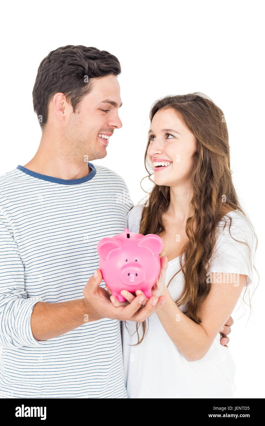 Couple holding piggy bank Stock Photo - Alamy