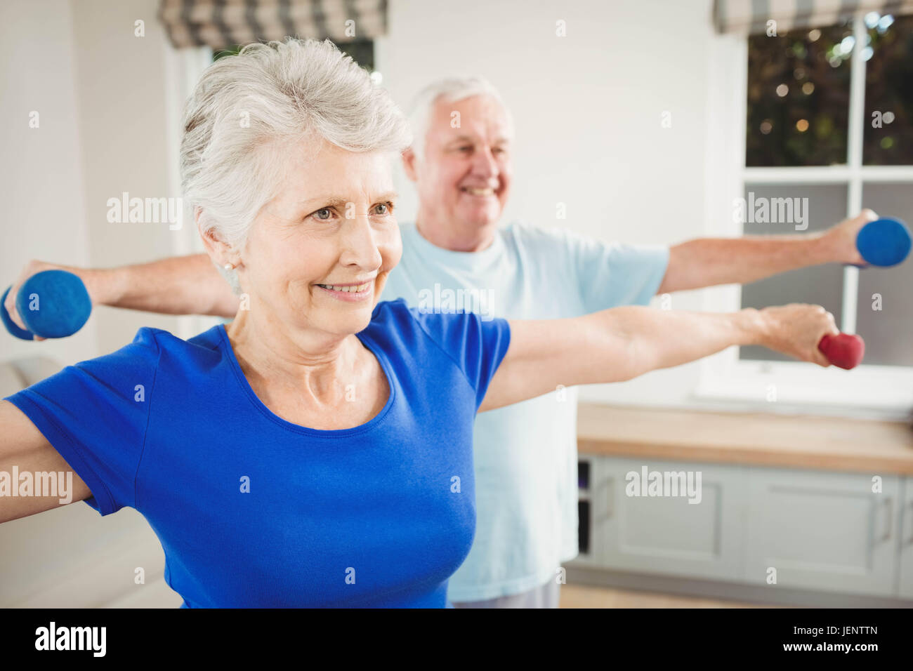 Senior couple performing stretching exercise Stock Photo - Alamy