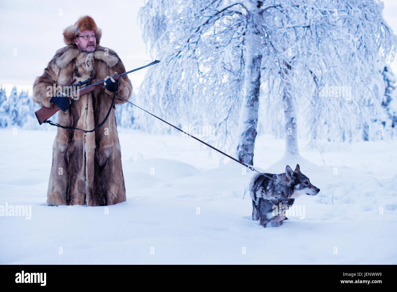 Mature man walking dog at winter Stock Photo