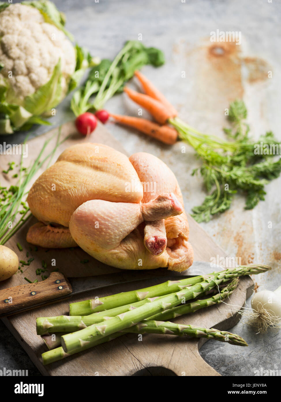Raw chicken on chopping board Stock Photo Alamy