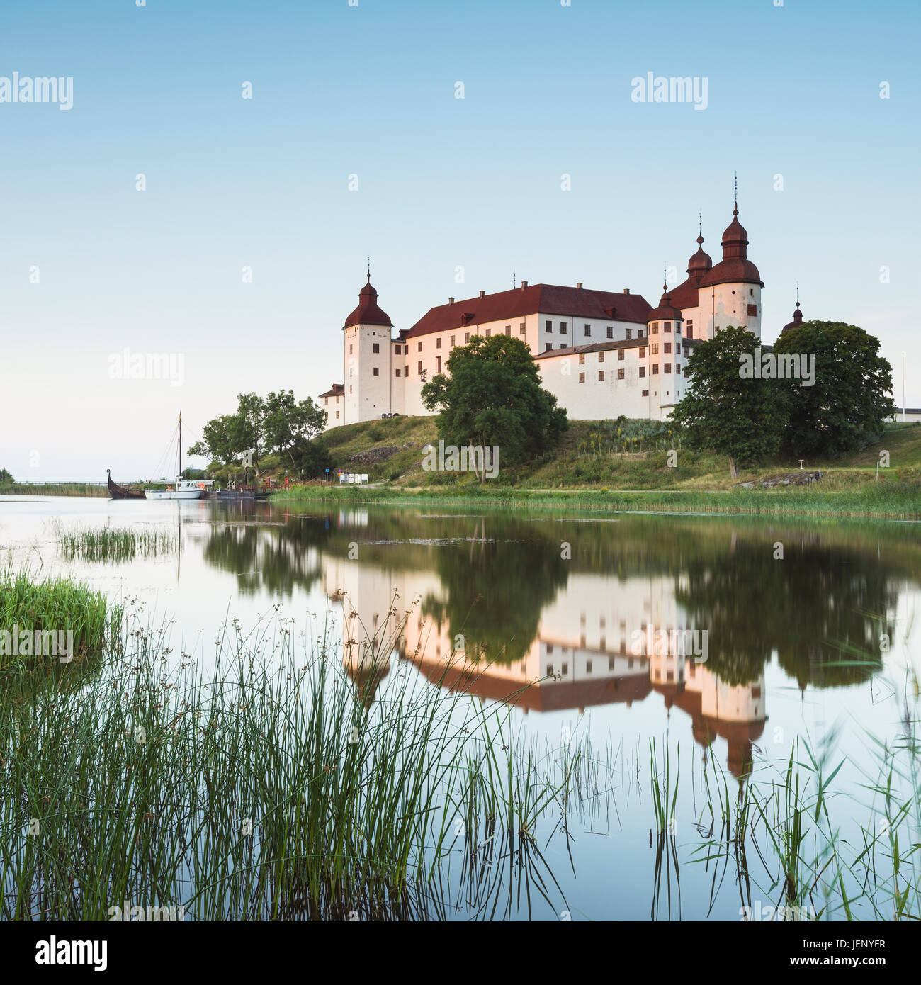 Castle reflecting in water Stock Photo