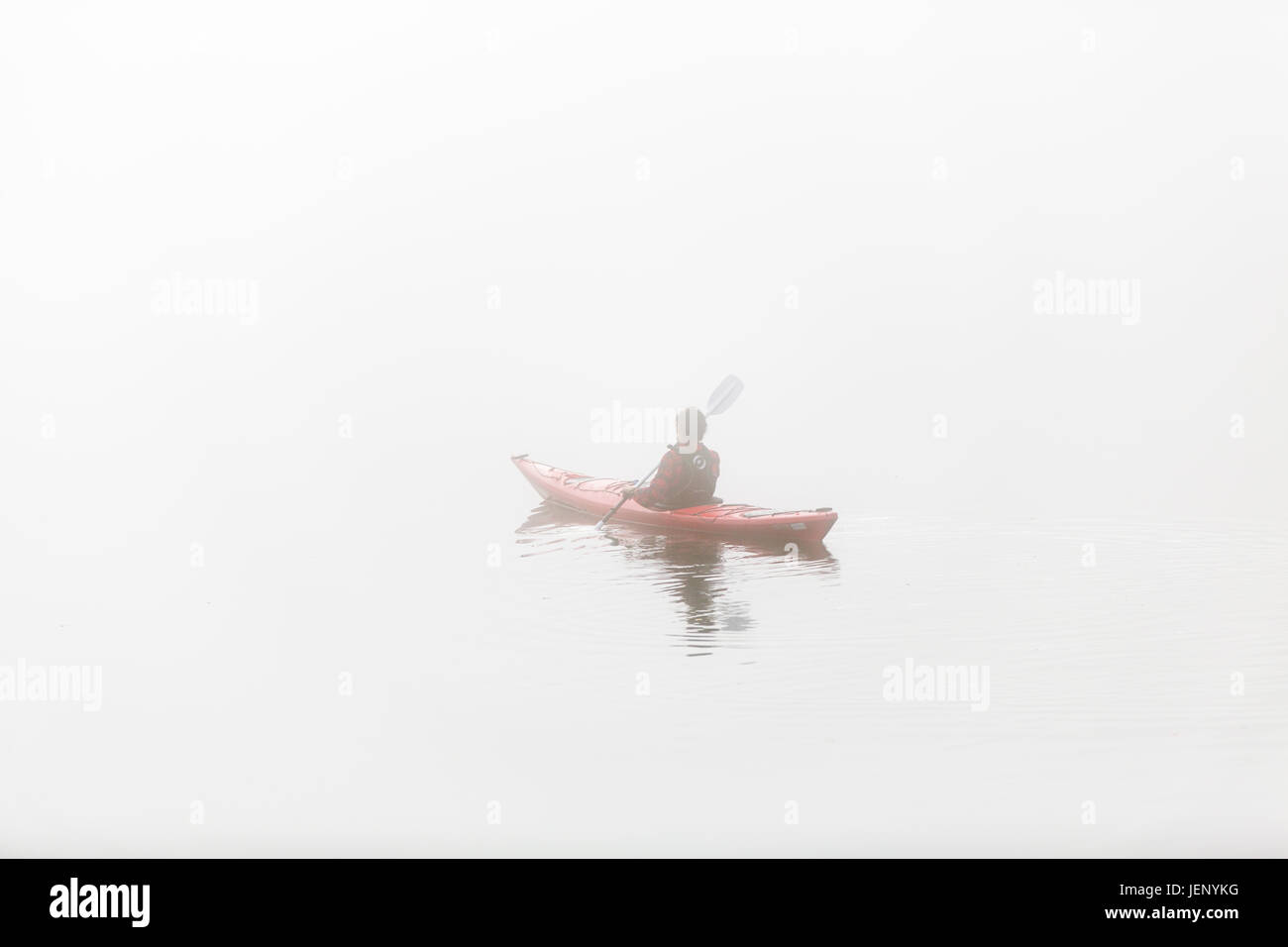 Person kayaking in fog Stock Photo Alamy
