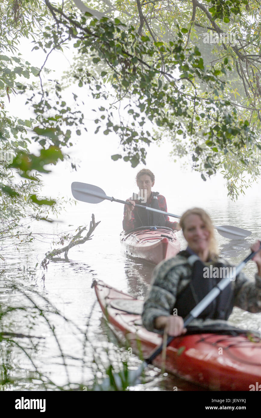 Women kayaking in fog Stock Photo Alamy