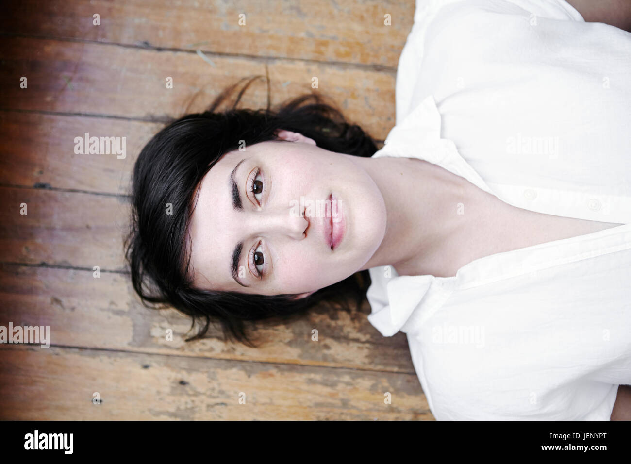 Thoughtful woman lying on back hi-res stock photography and images - Alamy