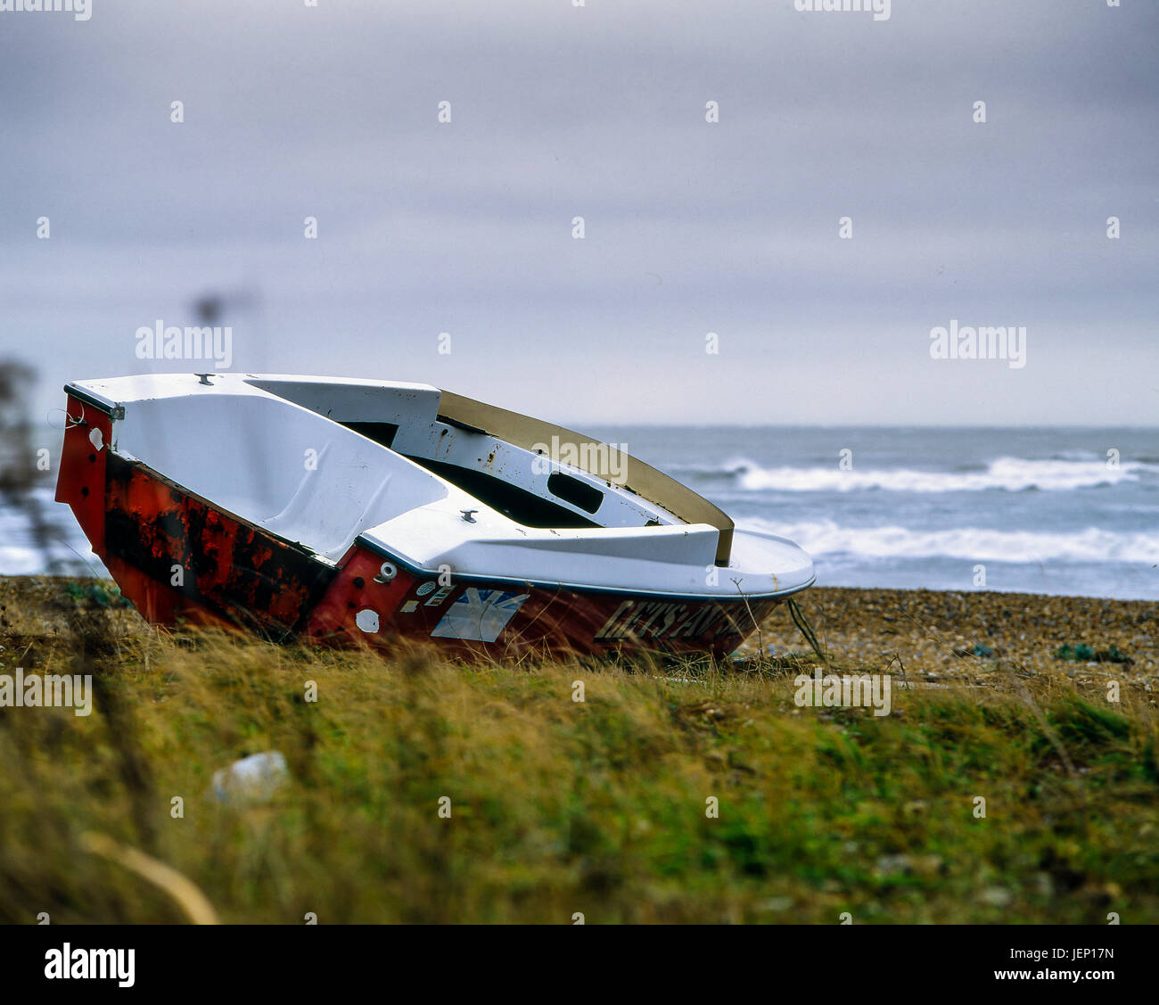 Boat left abandoned on beach, photographed with a Mamiya Rb67 film camera and some Fuji Velvia 50 120 film Stock Photo