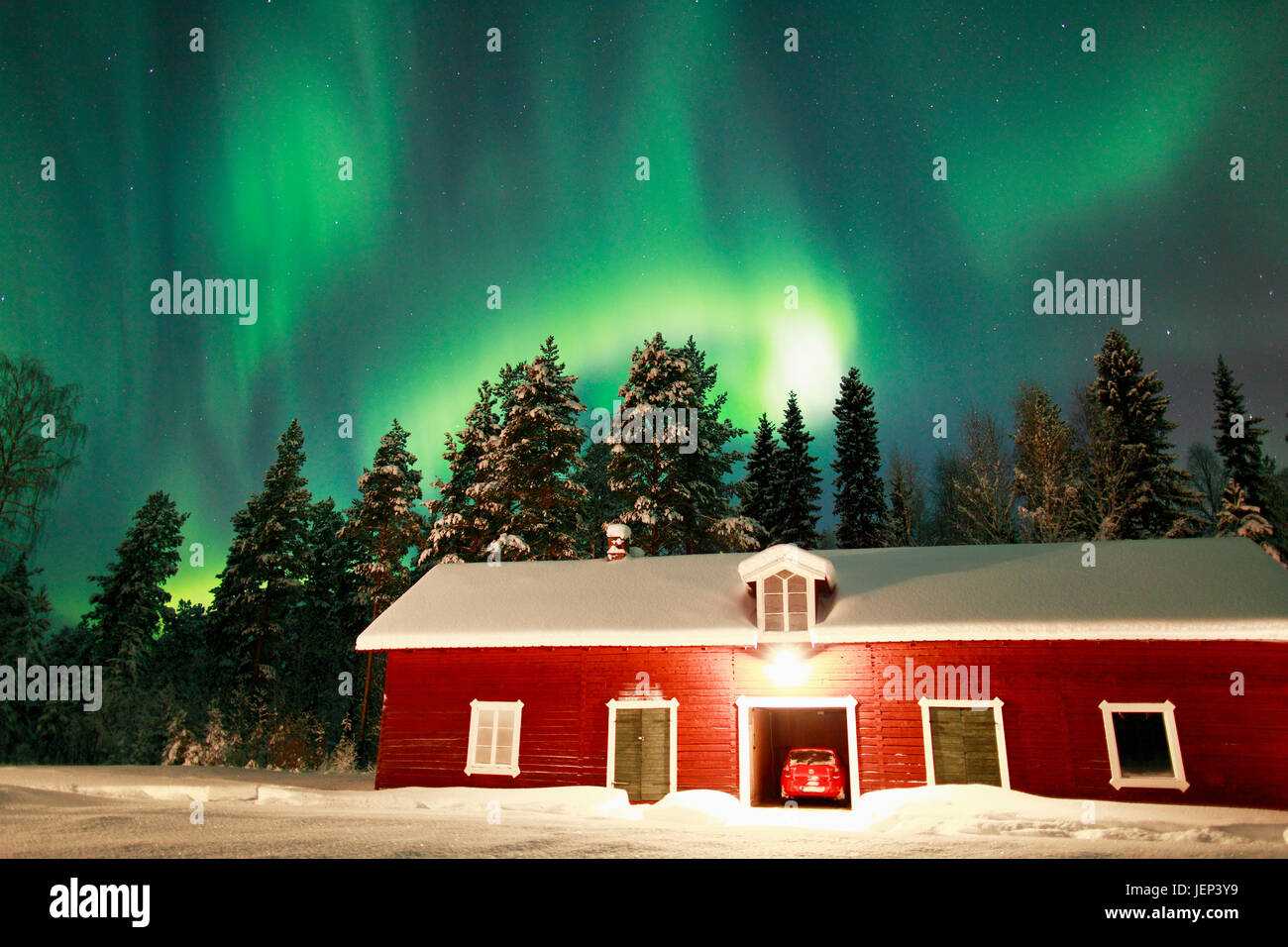 Aurora borealis above house Stock Photo - Alamy