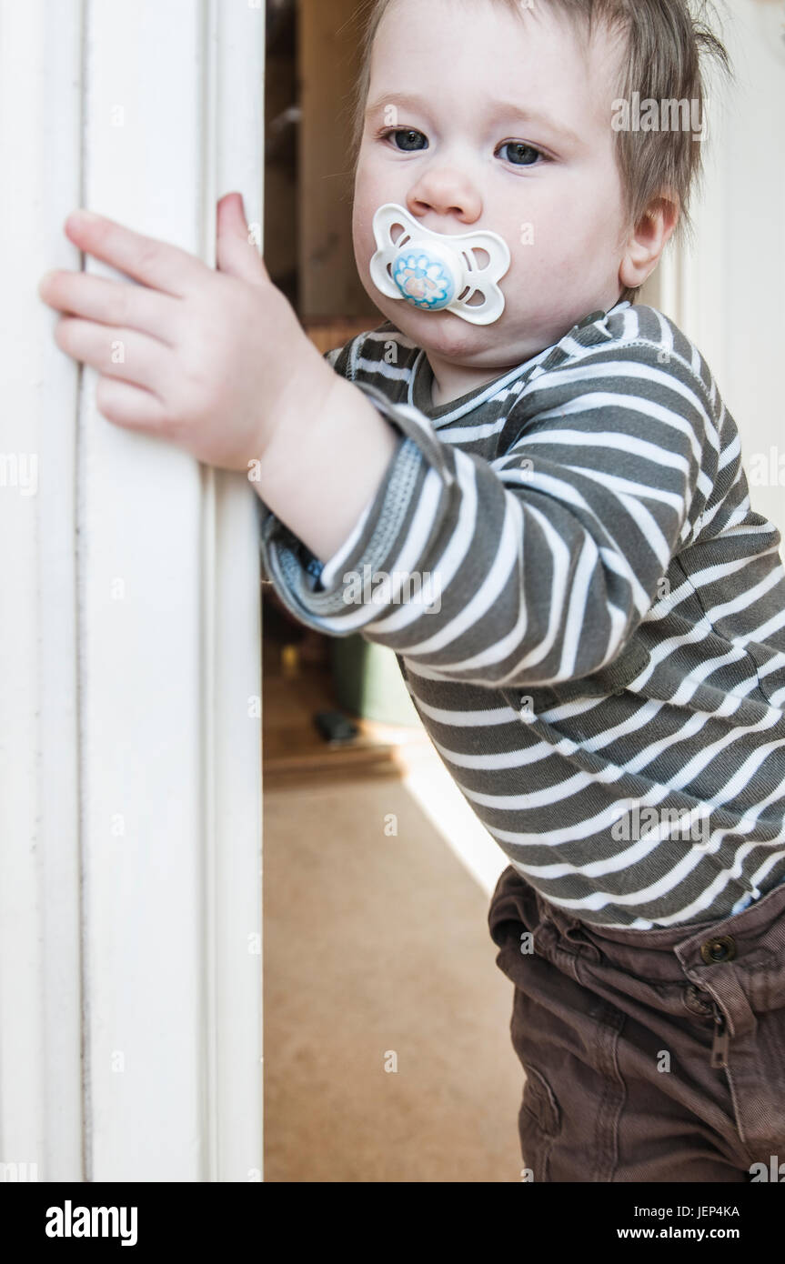 Boy with pacifier Stock Photo