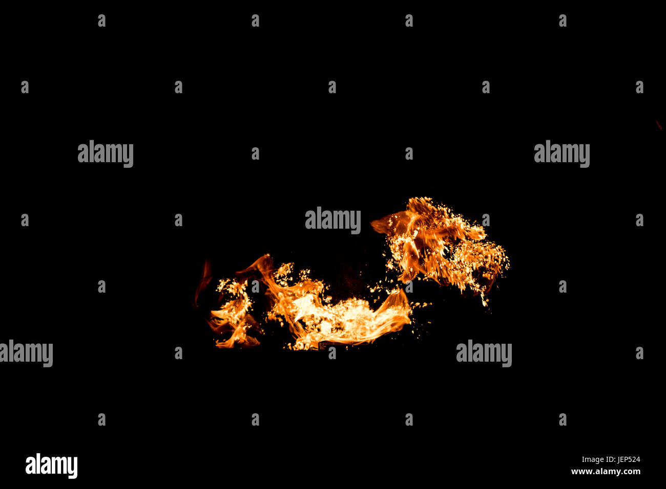 Diesel fuel explosion isolated on black background with yellow orange ...