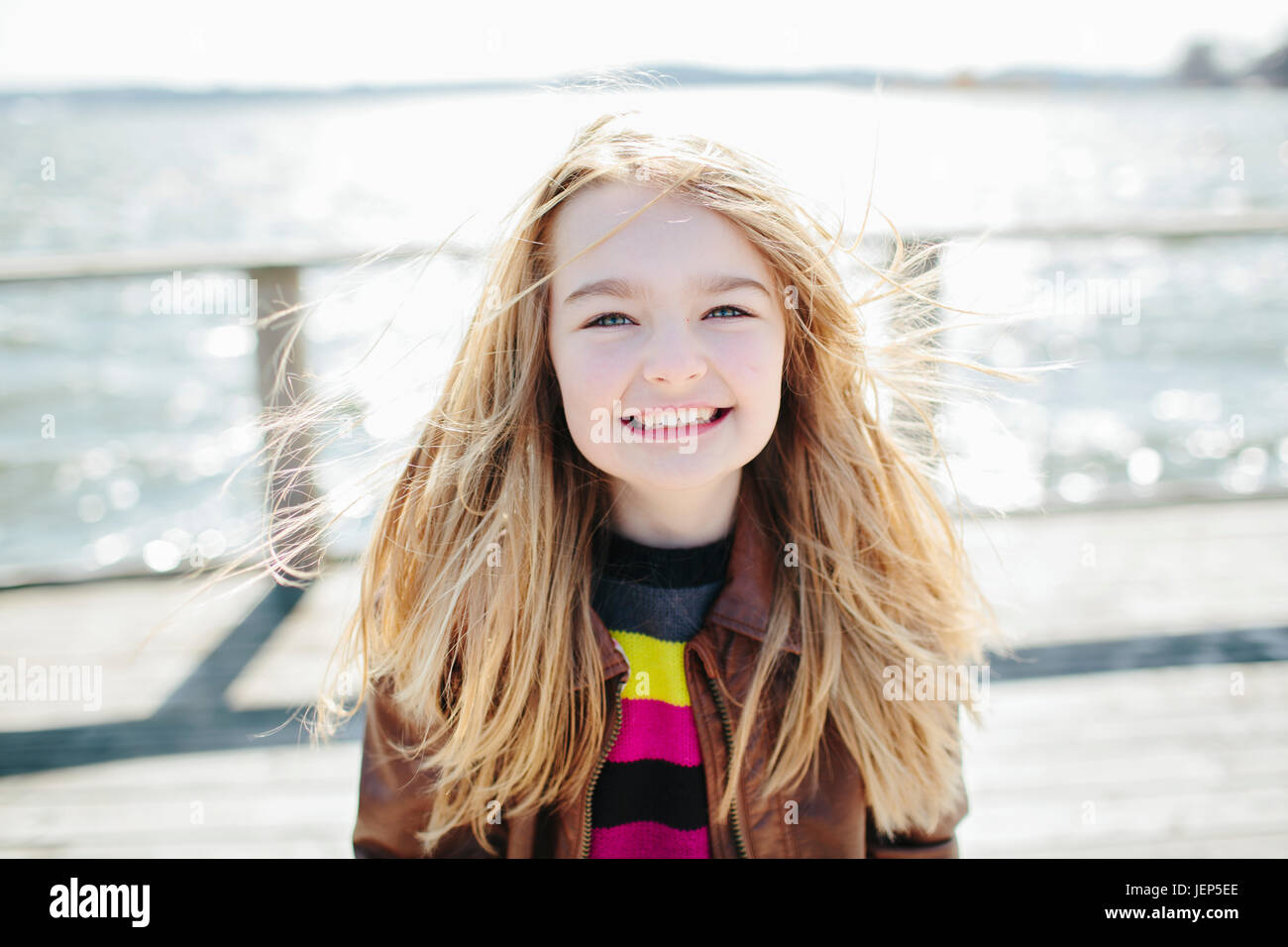 Portrait smiling girl blowing hi-res stock photography and images - Alamy