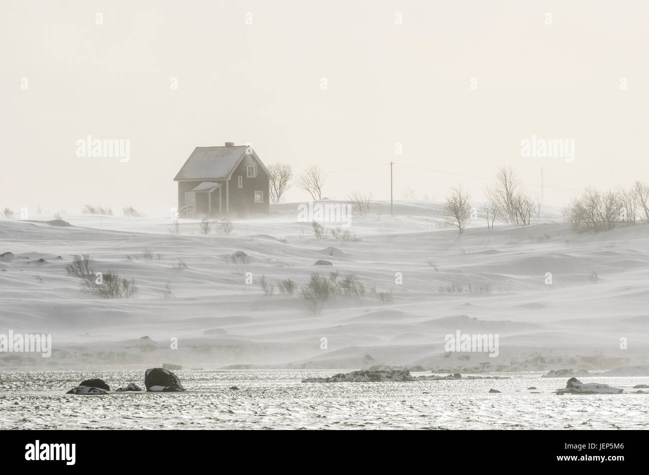 Snowy landscape with wooden house Stock Photo - Alamy