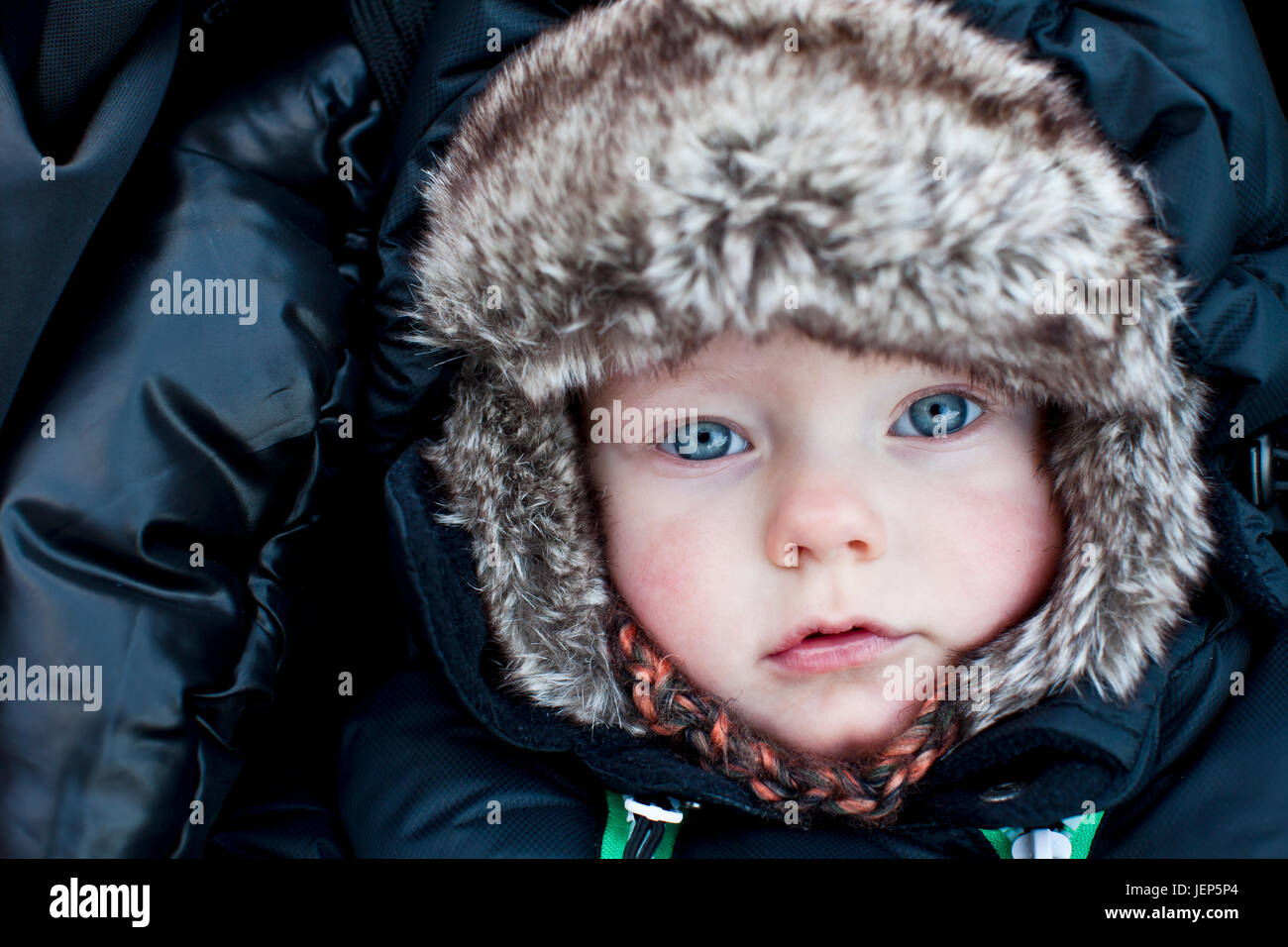 Boy wearing fur hat hires stock photography and images Alamy