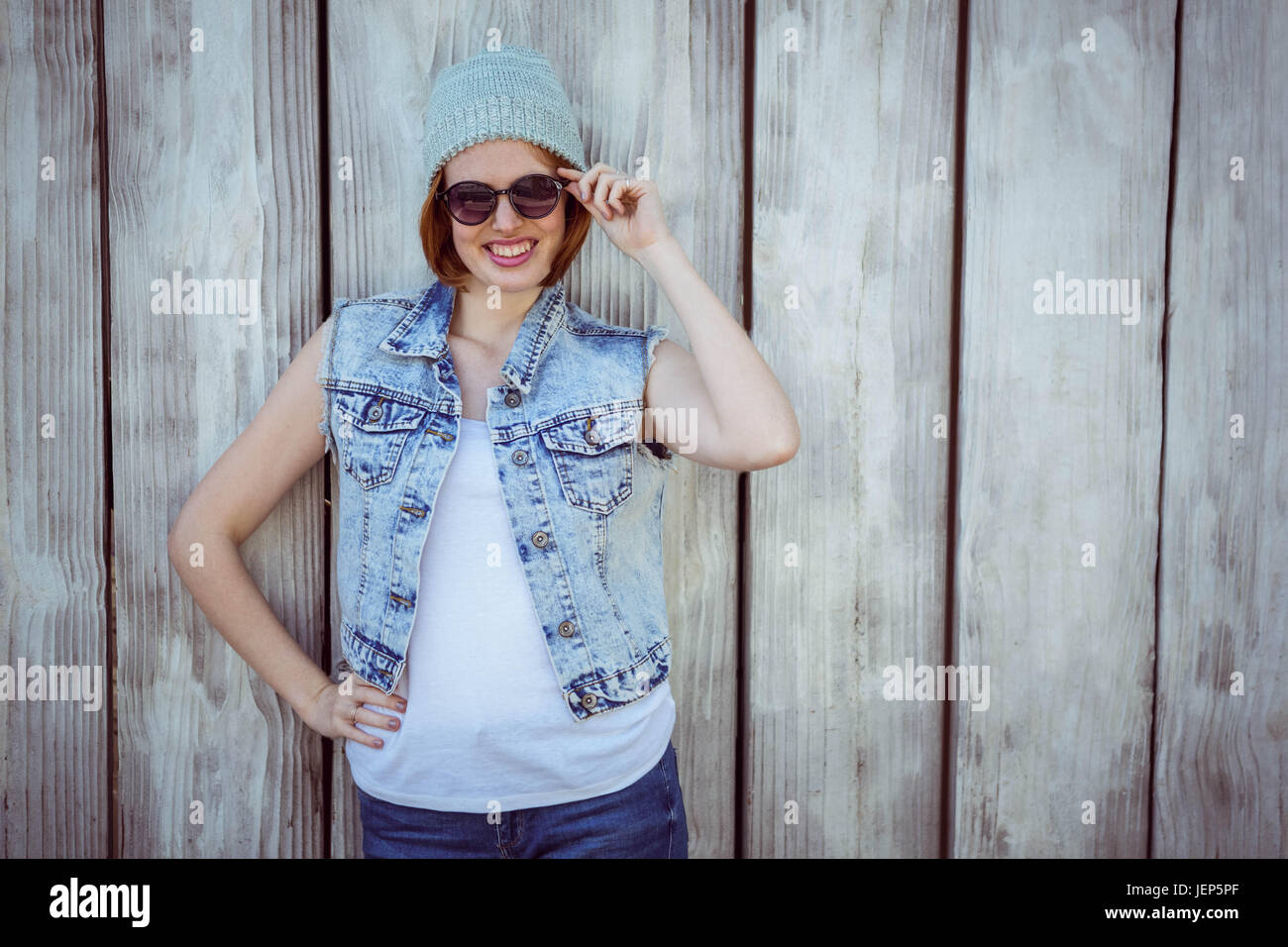 smiling hipster woman wearing a beanie hat Stock Photo