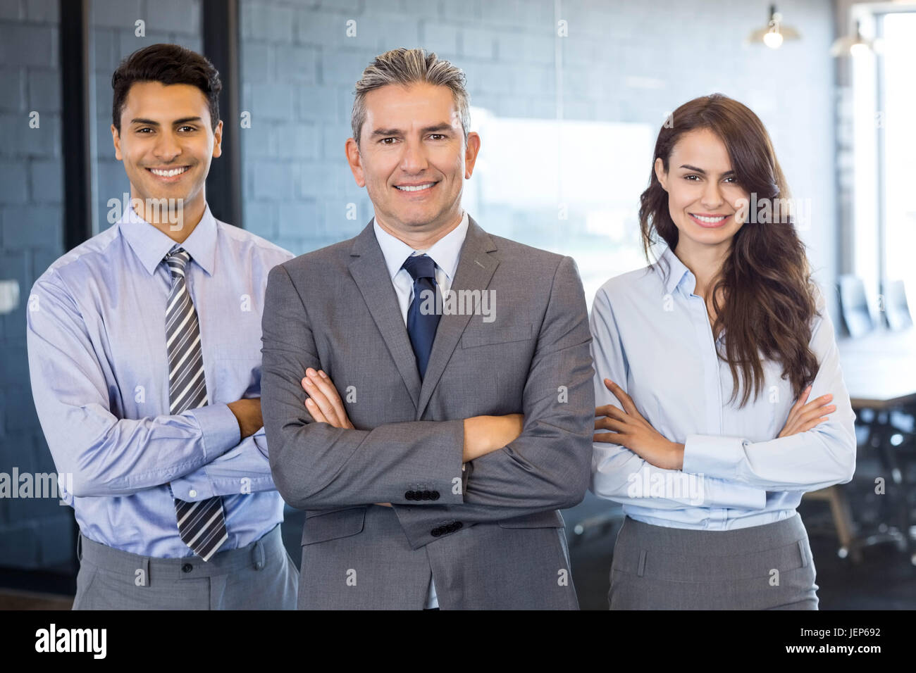 Portrait of confident business team Stock Photo - Alamy