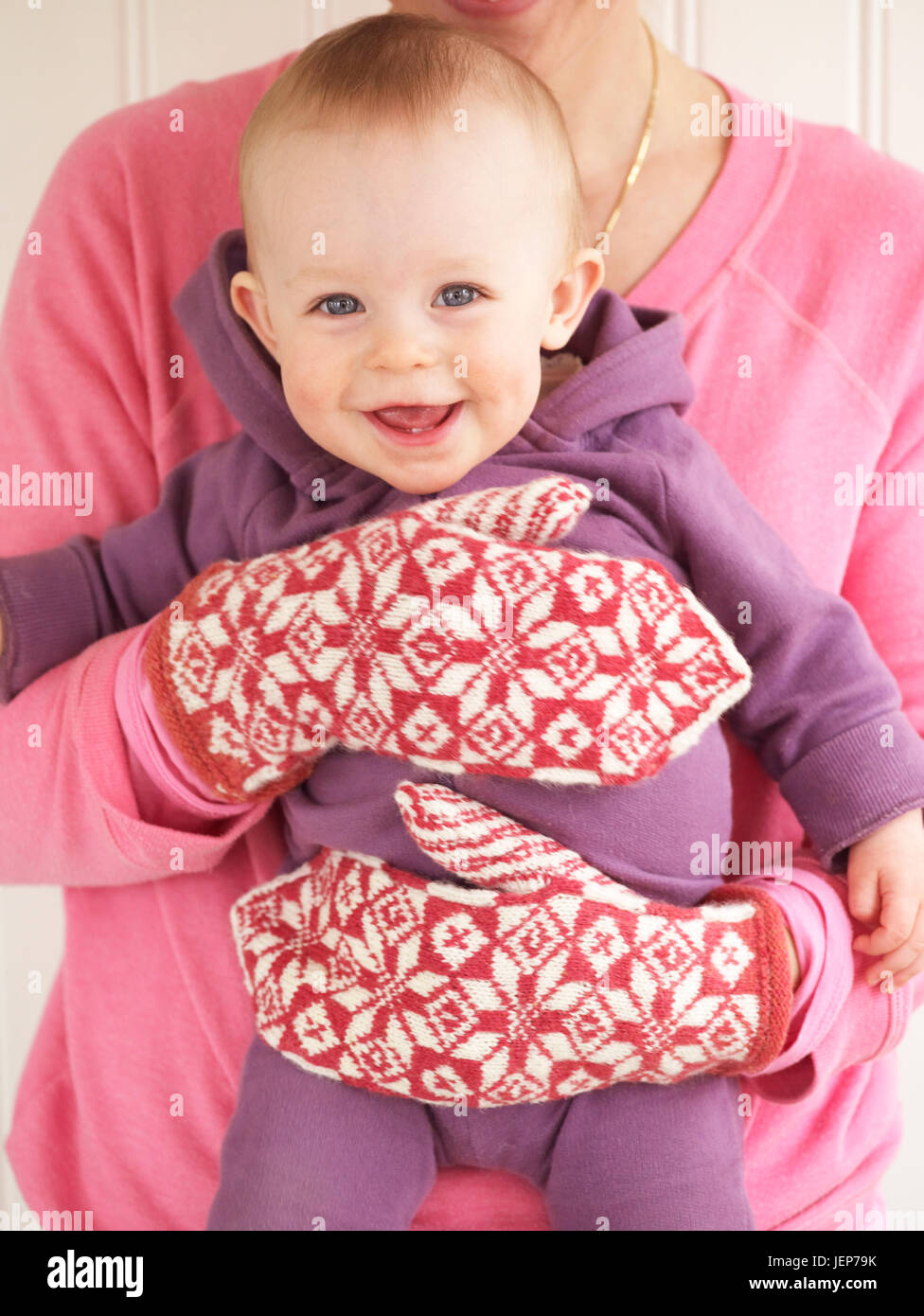 Woman holding her baby hi-res stock photography and images - Alamy
