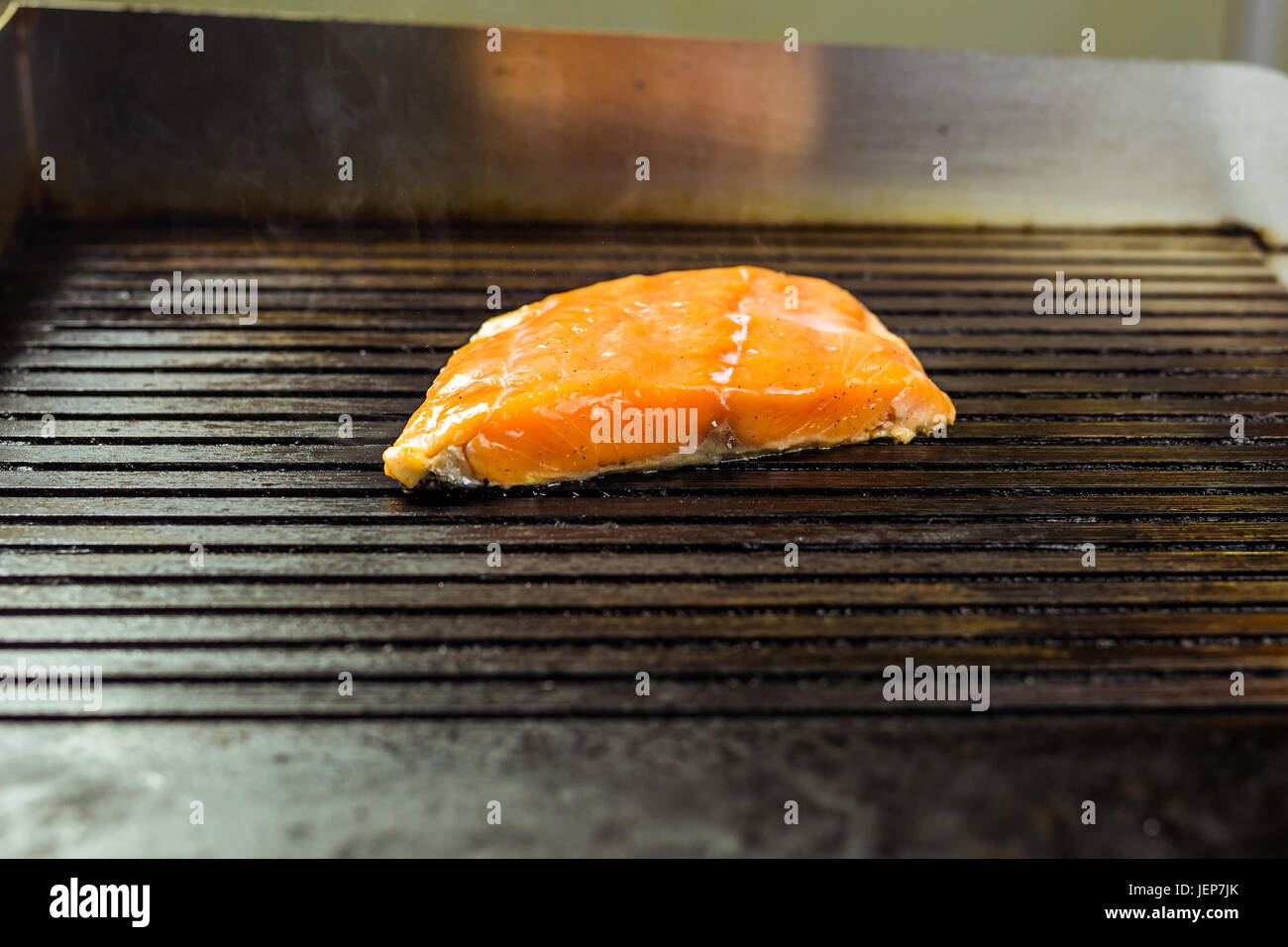 salmon roasted close up on home electronic grill plate tasty diet fish