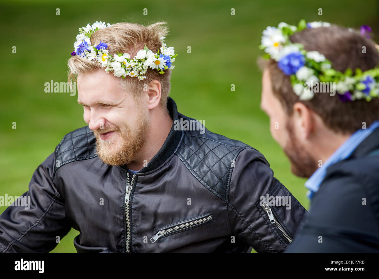 Men wearing flower wreaths Stock Photo - Alamy