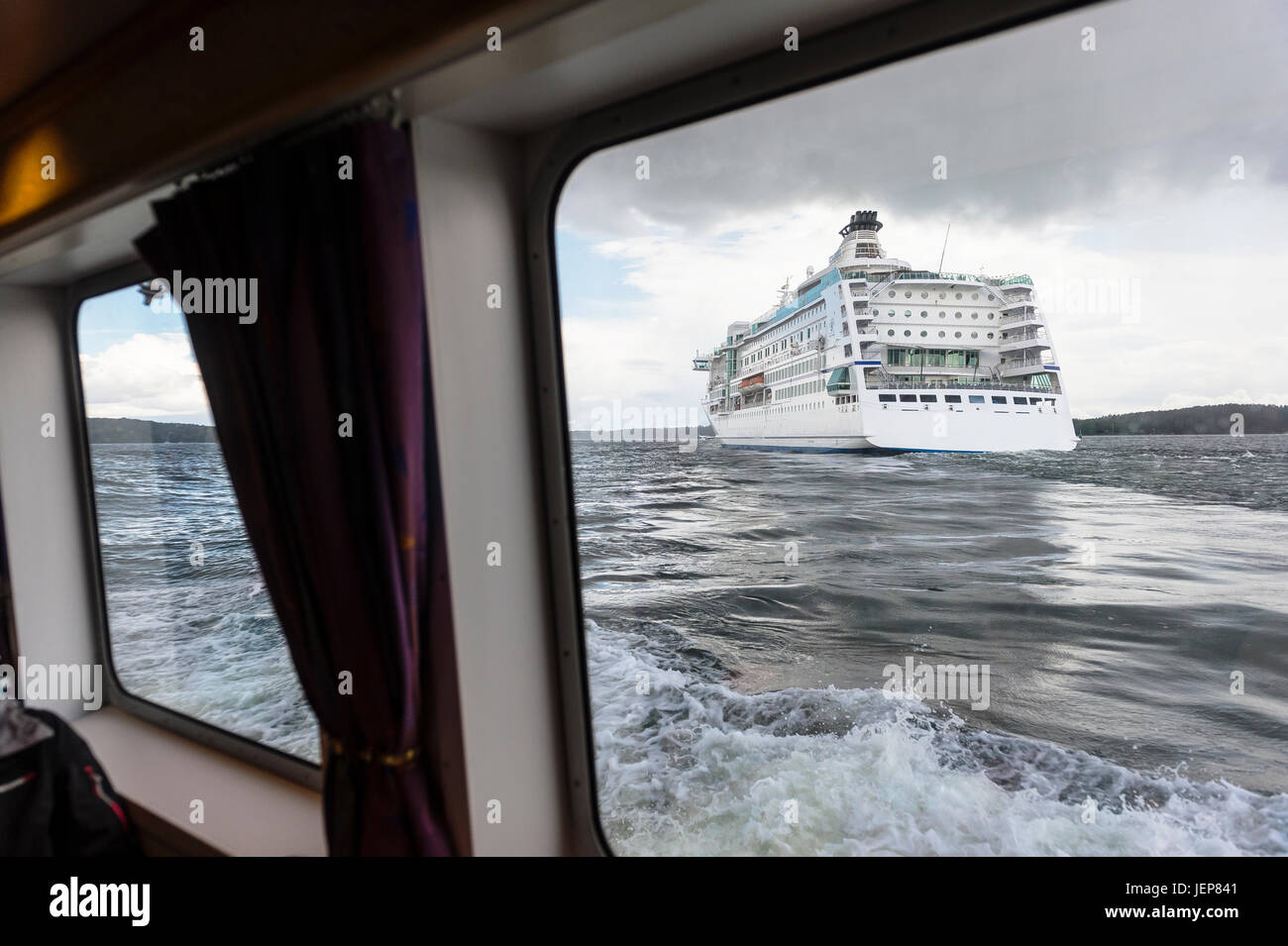 Cruise ship seen from boat Stock Photo