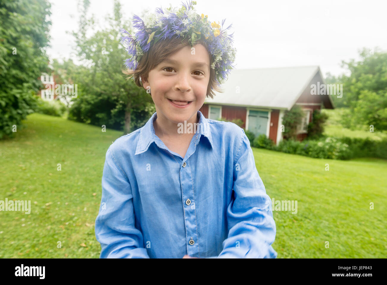 Portrait of girl wearing flower wreath Stock Photo - Alamy