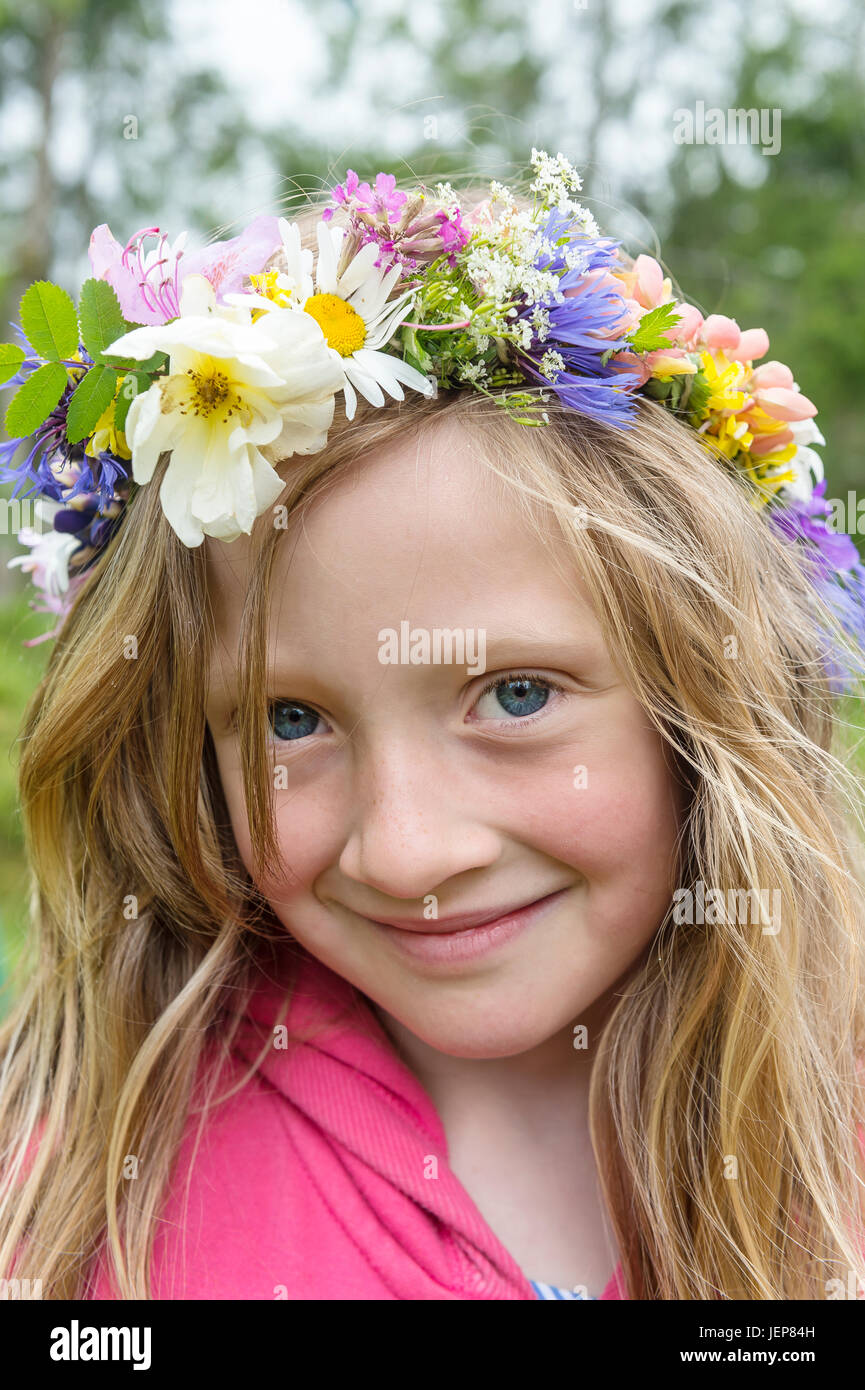 Portrait of girl wearing flower wreath Stock Photo - Alamy