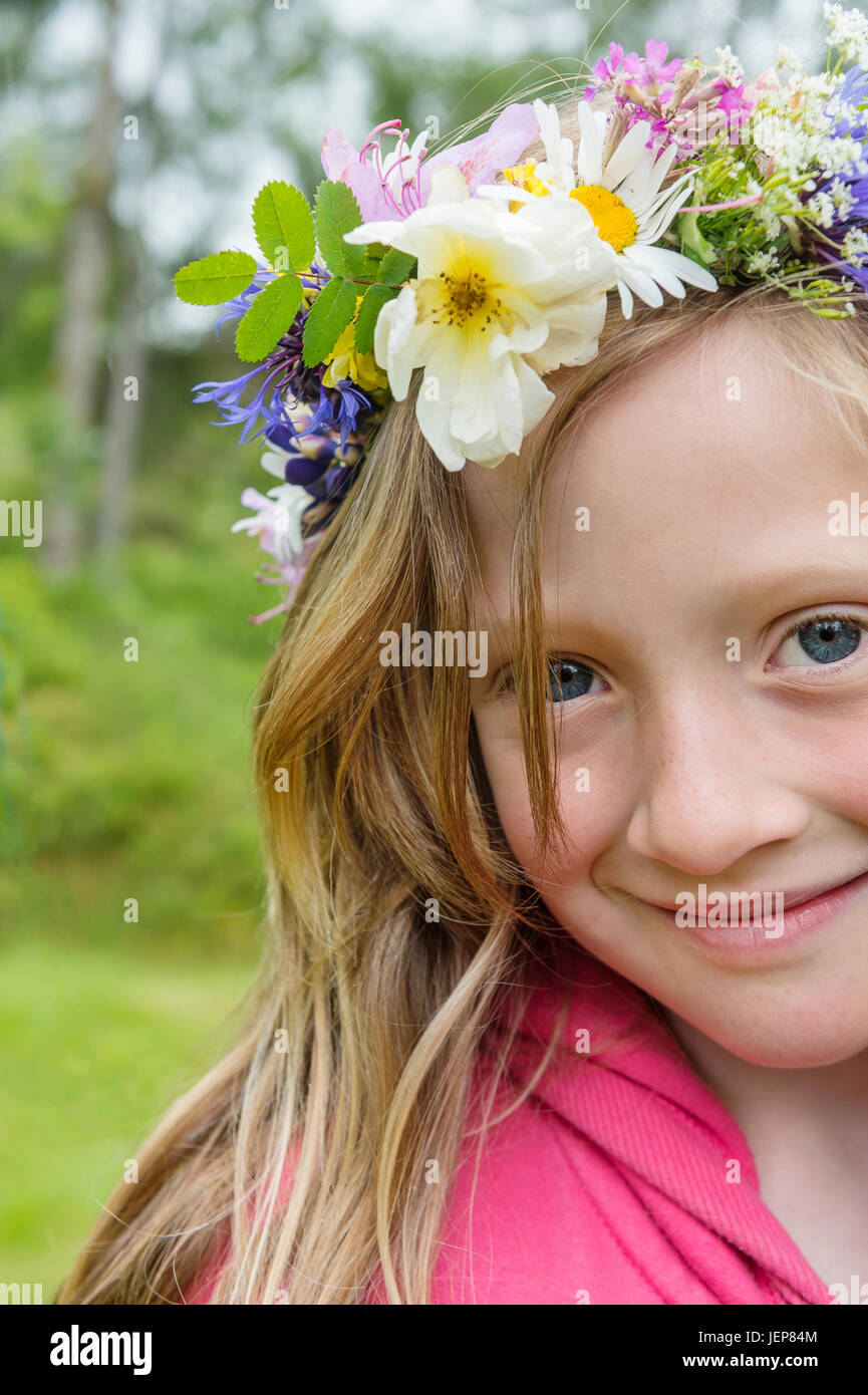 Portrait of girl wearing flower wreath Stock Photo - Alamy