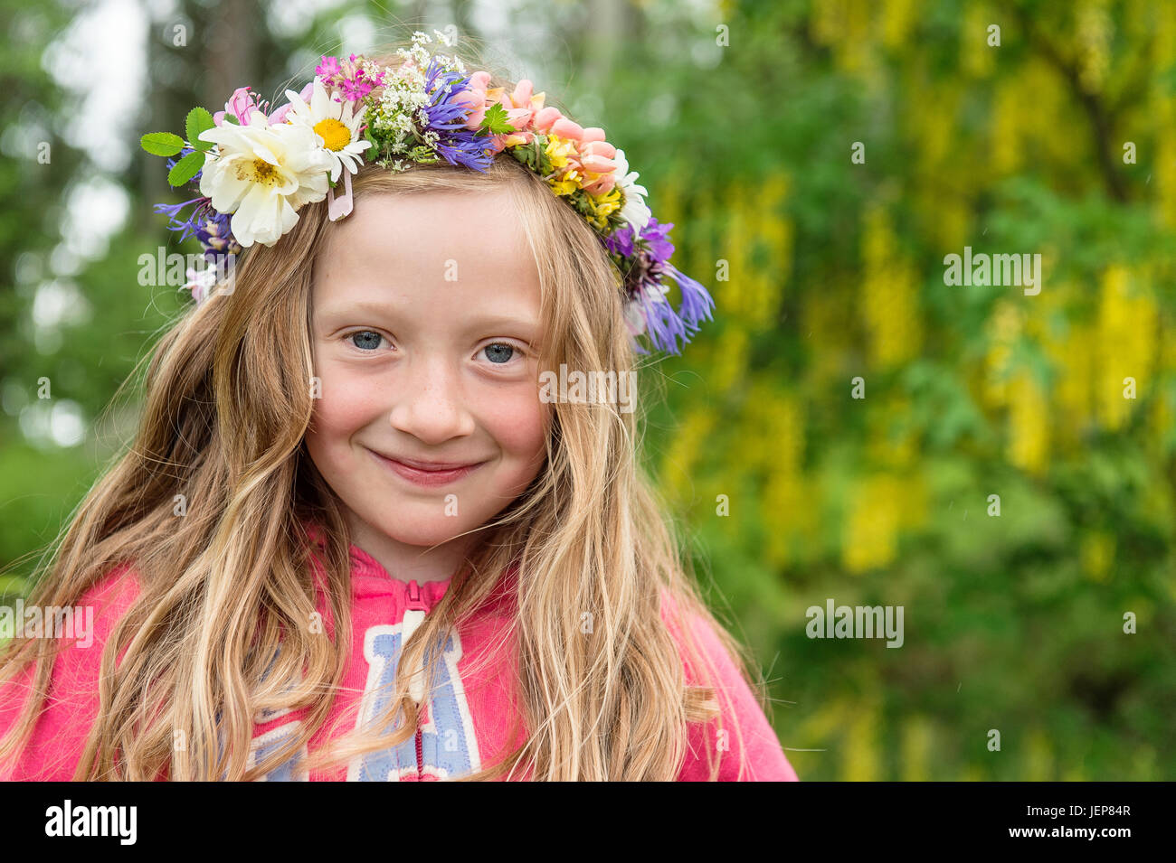 Portrait of girl wearing flower wreath Stock Photo - Alamy