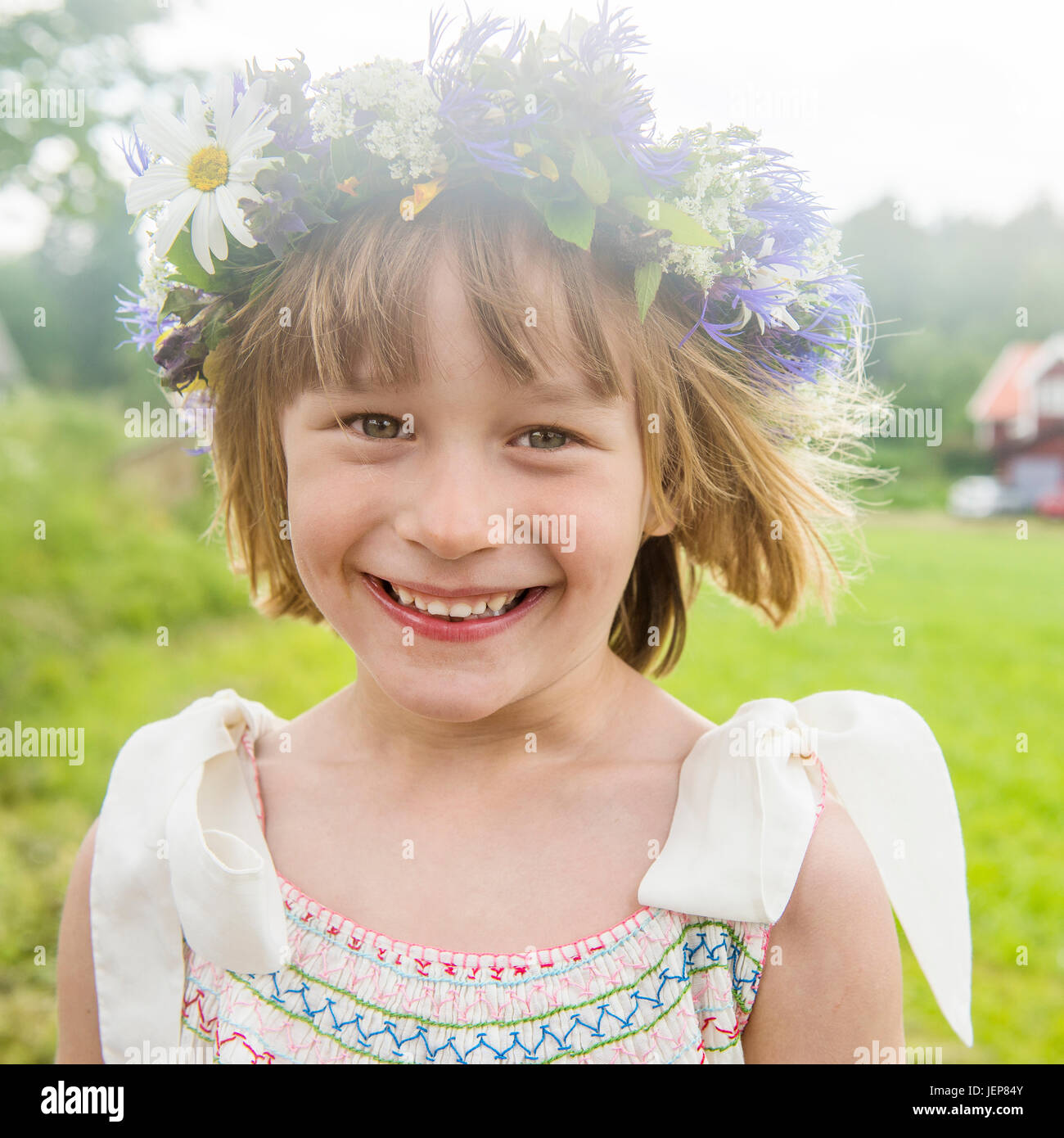 Portrait of girl wearing flower wreath Stock Photo - Alamy